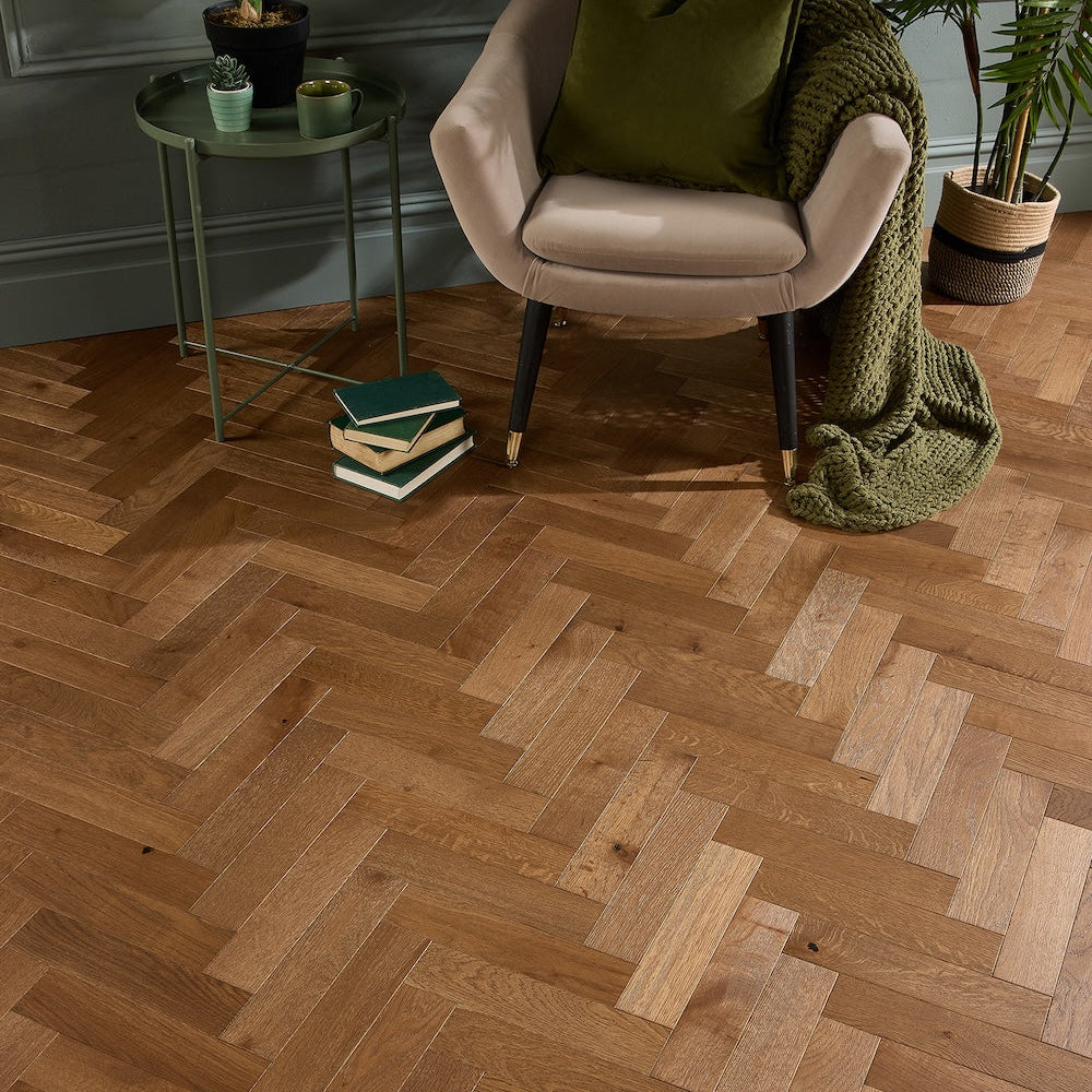 Brockwood engineered oak laid in herringbone, with an armchair